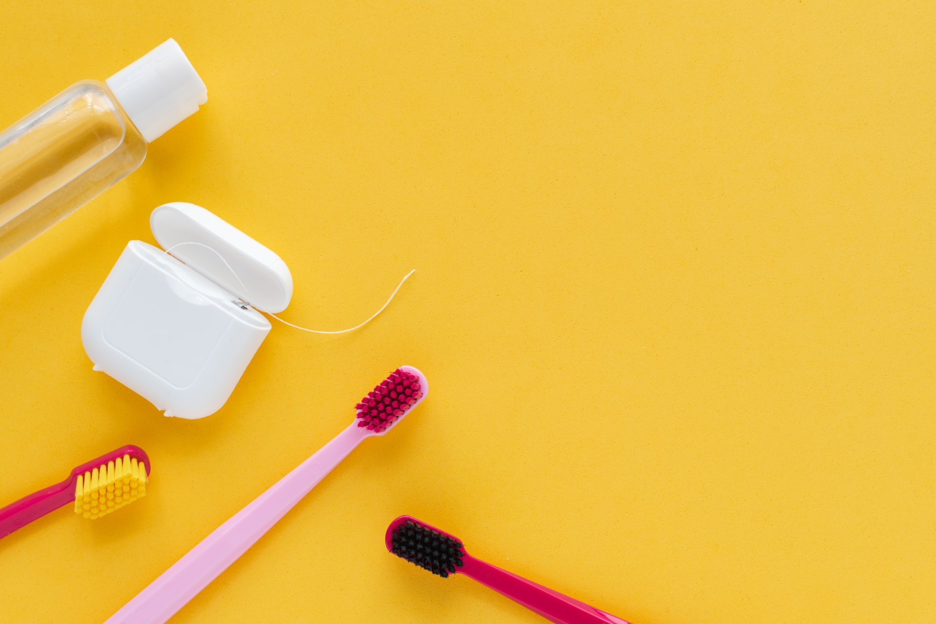 special kids toothbrushes on a yellow background