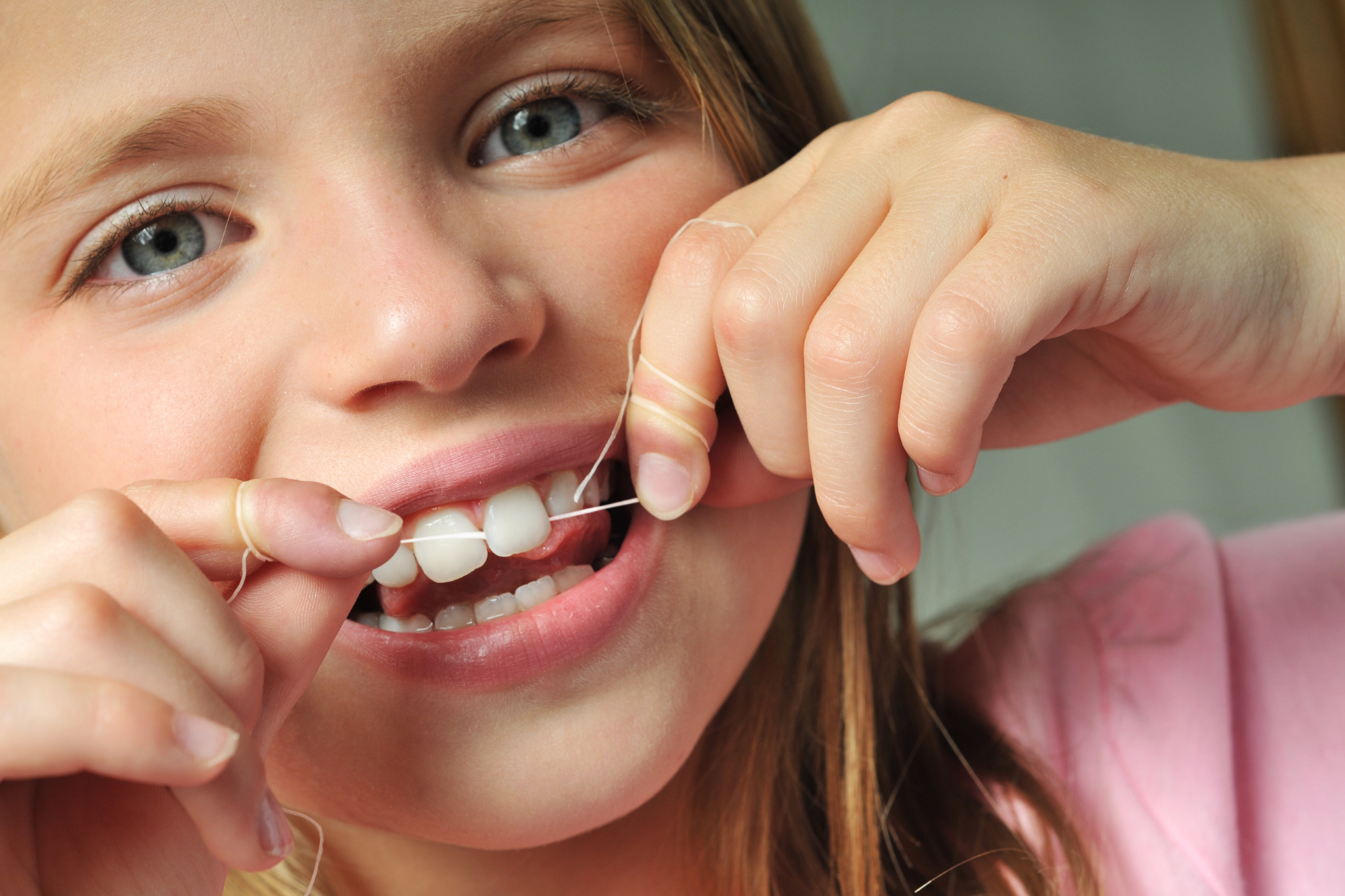 child using dental floss